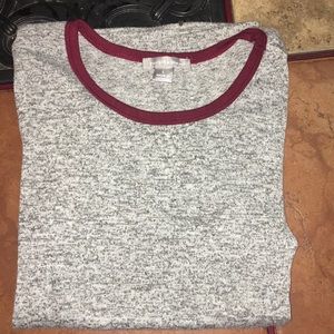 grey t shirt with maroon helmed neckline